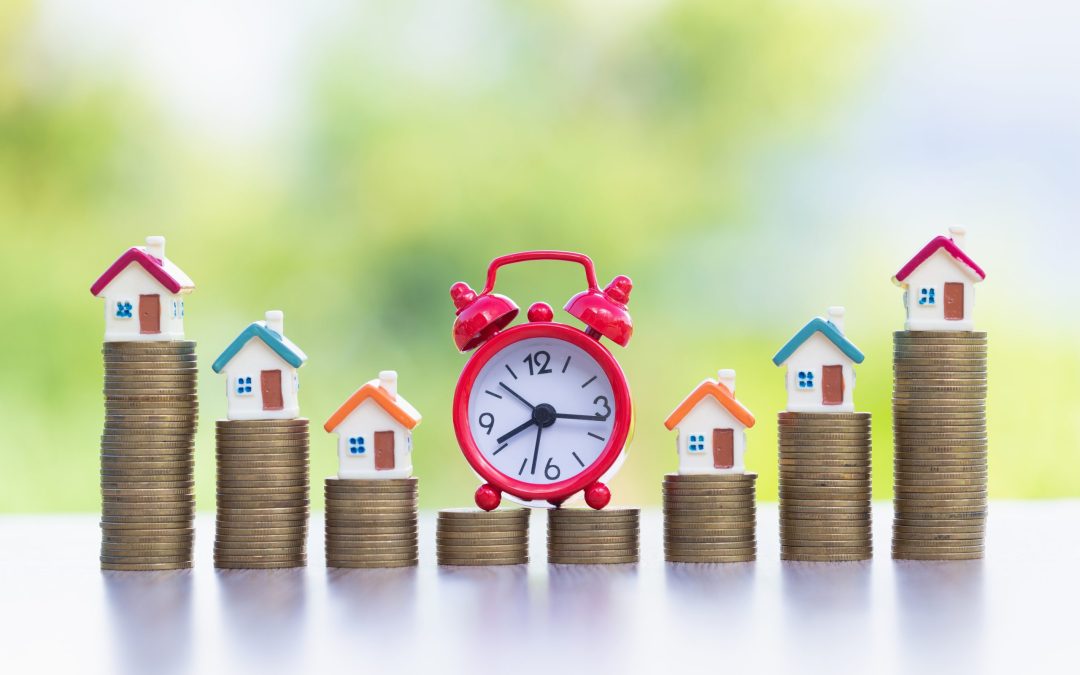 Mini house on stack of coins,Money and house,  Mortgage, Savings money for buy house and loan to business investment for real estate concept. Invesment and Risk Management, hourglass.