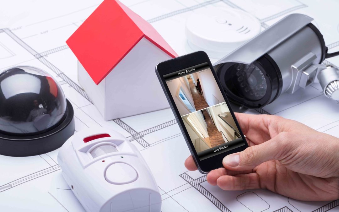 Architect Using Home Security System On Mobile Phone