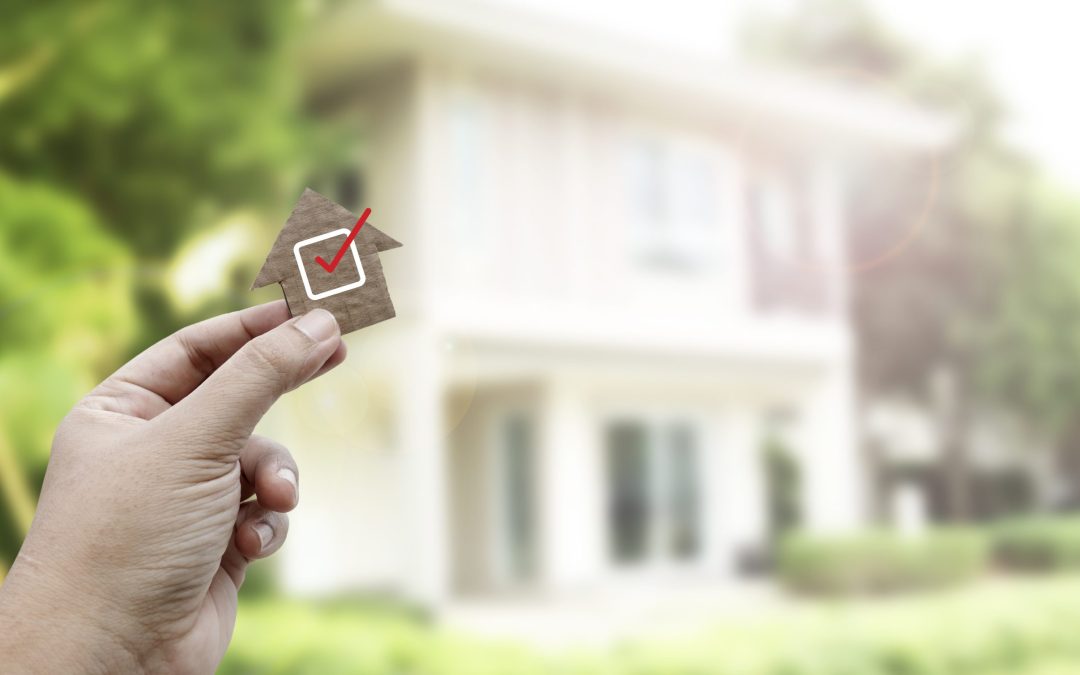 Hand holding brown paper , Home inspection