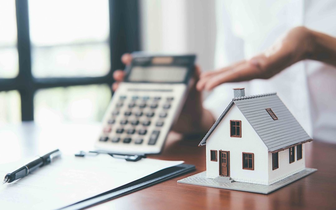 House model with real estate agent and customer discussing for c
